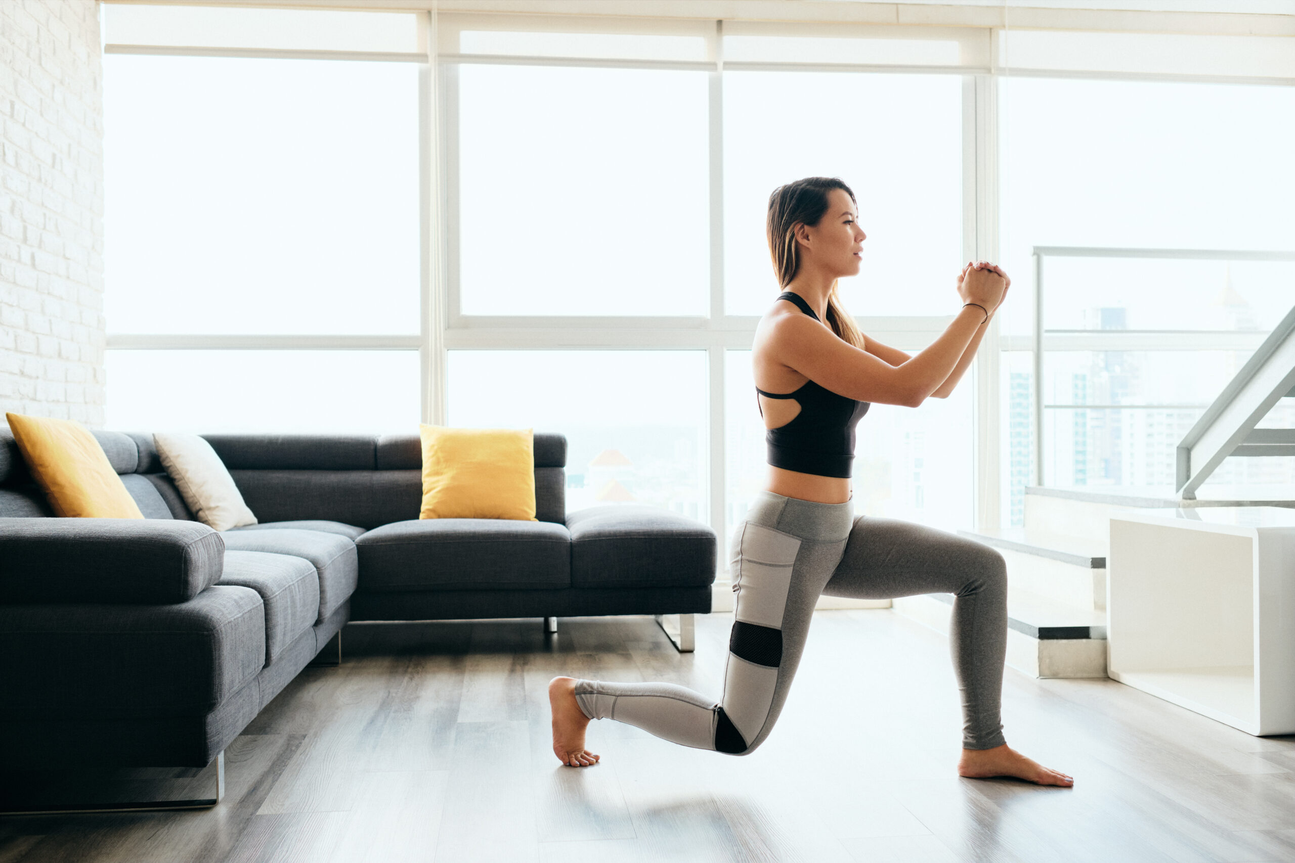 Adult Woman Training Legs Doing Inverted Lunges Exercise
