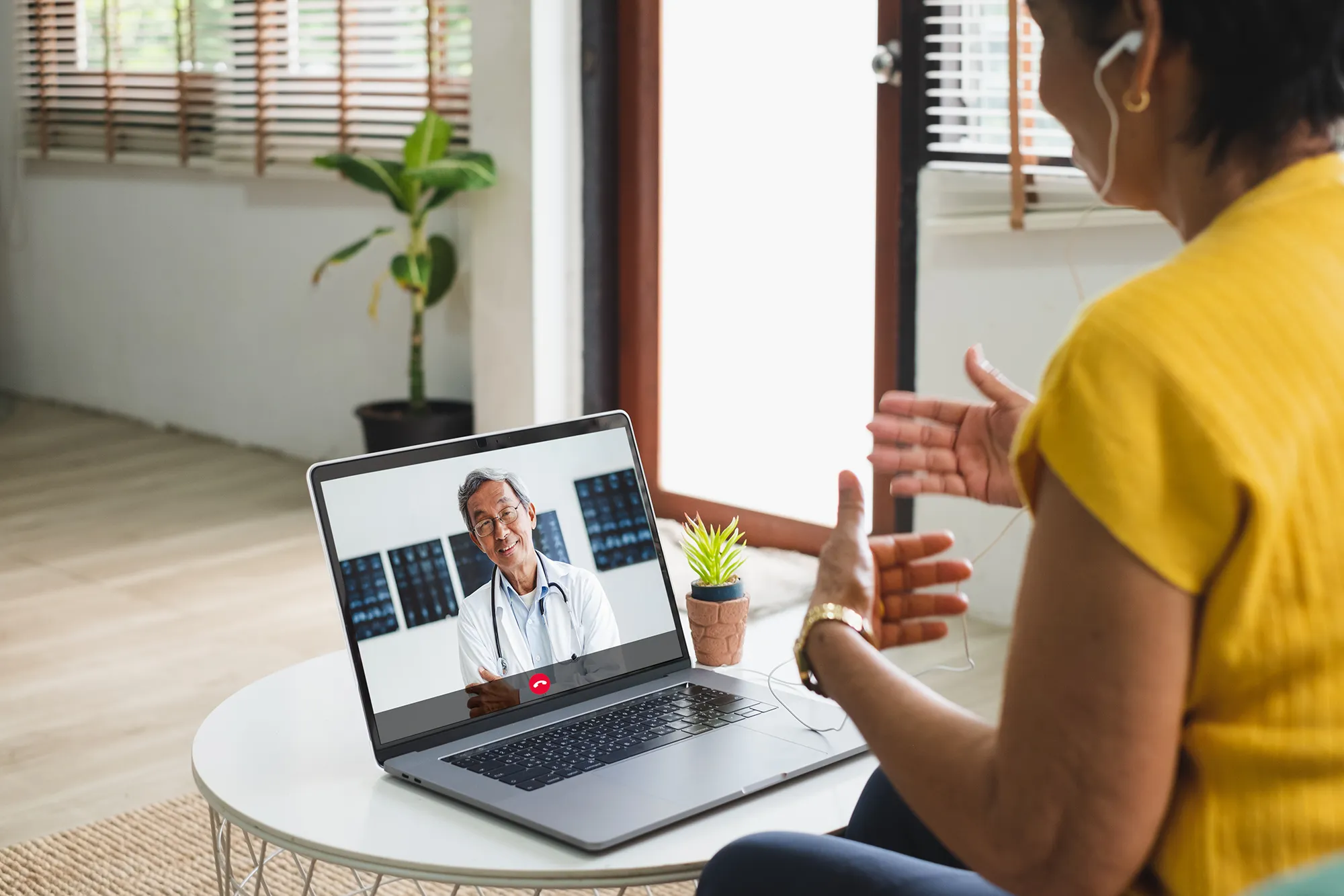 Asian senior video call with doctor telemedicine telehealth concept
