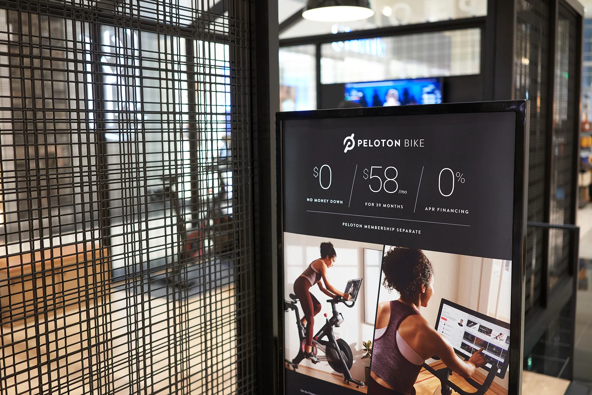 Tigard, Oregon, USA - Sep 28, 2019: Peloton bike monthly payment plan advertisement is seen outside a Peloton showroom in Washington Square Shopping Center in Tigard. 
