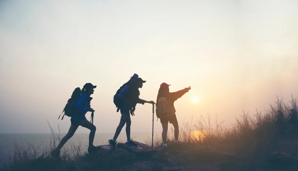 Hiker with backpack relaxing young woman hiking holiday, wild adventure.
